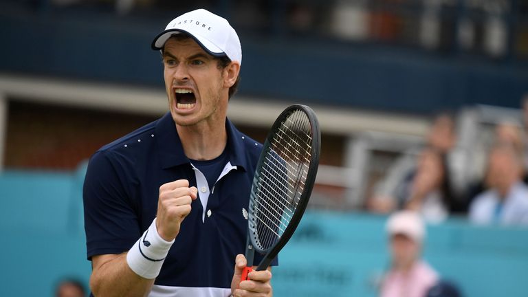 Andy Murray reacts to winning the first set as he plays with Spain's Feliciano Lopez against US player Rajeev Ram and Britain's Joe Salisbury during their men's doubles final tennis match at the ATP Fever-Tree Championships tournament at Queen's Club in west London on June 23, 2019. 