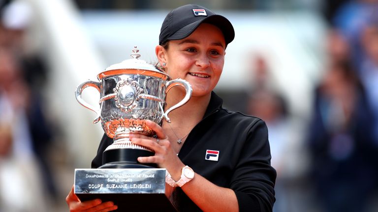 Ashleigh Barty of Australia celebrates victory with the trophy following the ladies singles final against Marketa Vondrousova of The Czech Republic during Day fourteen of the 2019 French Open at Roland Garros on June 08, 2019 in Paris, France. 