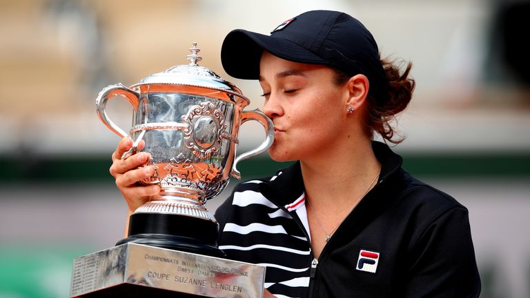Ashleigh Barty of Australia kisses the trophy as she celebrates victory following the ladies singles final against Marketa Vondrousova of The Czech Republic during Day fourteen of the 2019 French Open at Roland Garros on June 08, 2019 in Paris, France.