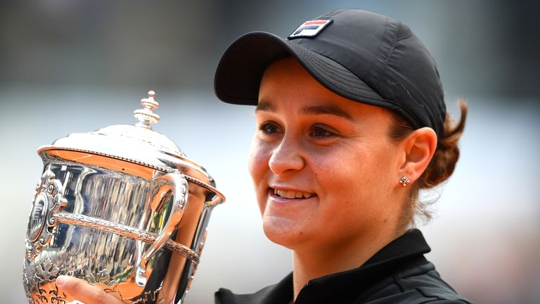 Ashleigh Barty of Australia celebrates victory with the trophy following the ladies singles final against Marketa Vondrousova of The Czech Republic during Day fourteen of the 2019 French Open at Roland Garros on June 08, 2019 in Paris, France