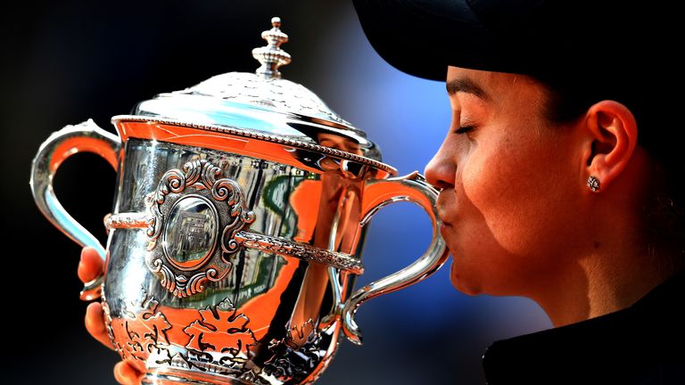 Ashleigh Barty of Australia kisses the trophy as she celebrates victory following the ladies singles final against Marketa Vondrousova of The Czech Republic during Day fourteen of the 2019 French Open at Roland Garros on June 08, 2019 in Paris, France.