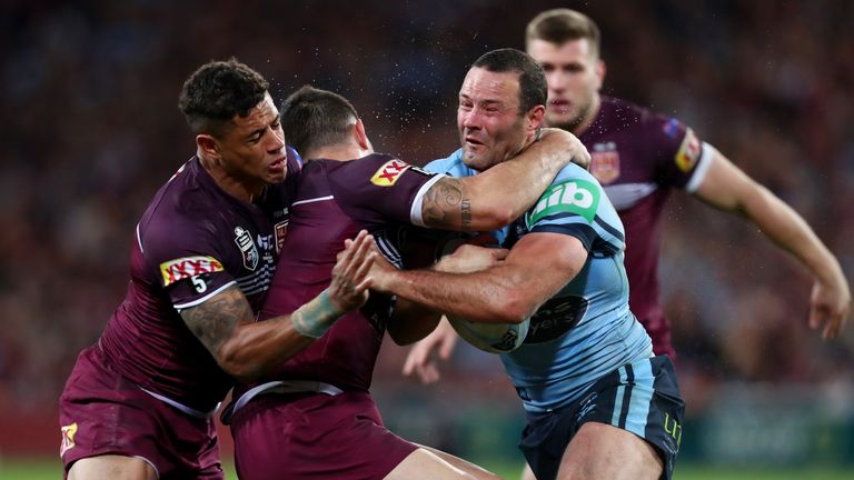 Boyd Cordner of the Blues is tackled during Game I in Brisbane