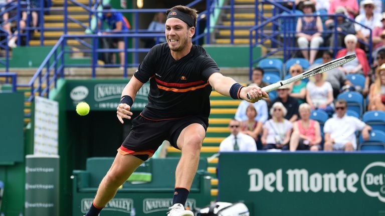 Cameron Norrie returns against France's Jeremy Chardy during their men's first round match at the ATP Nature valley International tennis tournament in Eastbourne, southern England on June 25, 2019