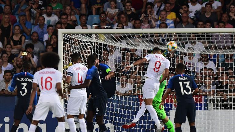 Domnic Solanke leaps for a header in England U21s' match against France in Italy