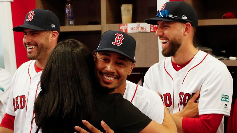 The Duchess of Sussex shares a hug with her 'cousin' Boston Red Sox's Mookie Betts