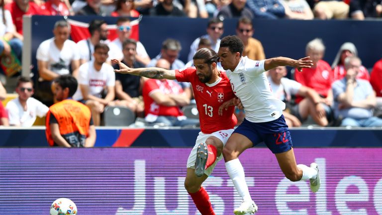 Ricardo Rodriguez of Switzerland battles for possession with Trent Alexander-Arnold of England 
