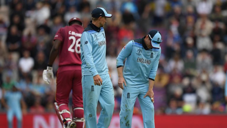 England captain Eoin Morgan feels his left leg after pulling up in the field at the Hampshire Bowl