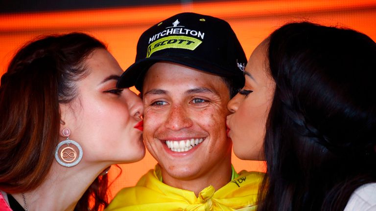 Hostesses kiss Team Mitchelton rider Colombia's Esteban Chaves as he celebrates on the podium after winning stage nineteen of the 102nd Giro d'Italia - Tour of Italy - cycle race, 151kms from Treviso to San Martino di Castrozza on May 31, 2019