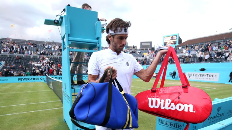 Feliciano Lopez of Spain, partner of Andy Murray of Great Britain walks off the court after play is stopped due to poor light during his Quarter-Final Doubles Match against Daniel Evans and Ken Skupski of Great Britain during day Five of the Fever-Tree Championships at Queens Club on June 21, 2019 in London, United Kingdom.