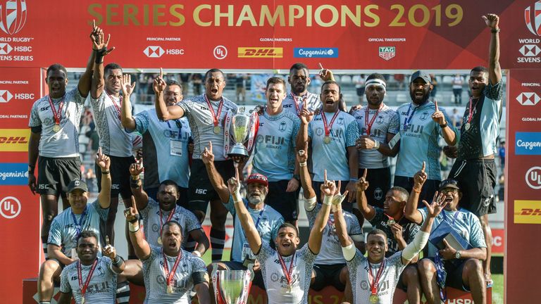 Fiji's team celebrates with the cup after winning the HSBC World Rugby Sevens Series