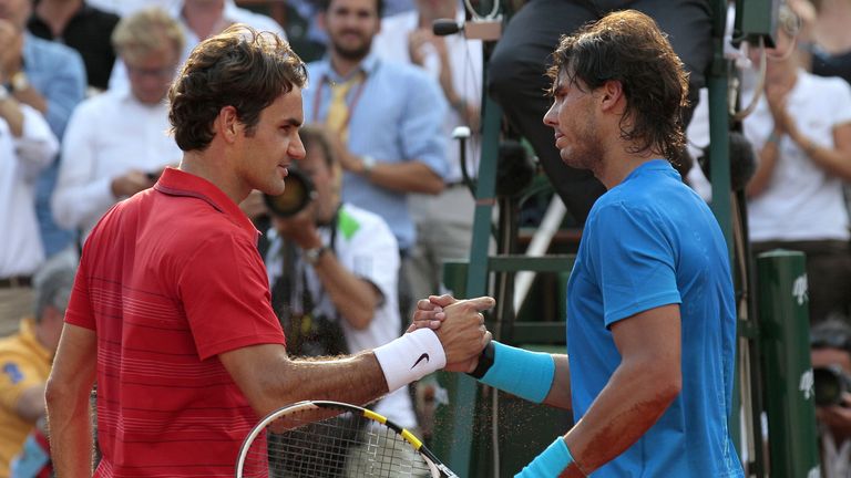 Roger Federer and Rafael Nadal after the French Open final in 2011