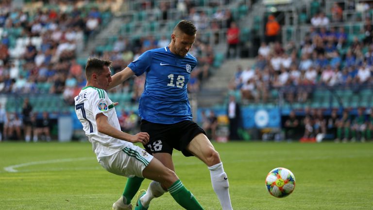Northern Ireland's Gavin Whyte (left) and Estonia's Karol Mets battle for the ball 