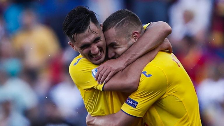George Puscas (right) scored twice for Romania in the first half