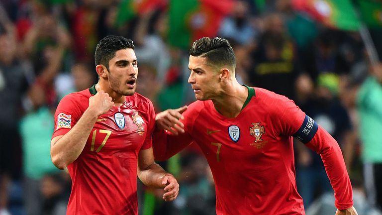 Goncalo Guedes celebrates with Portugal's forward Cristiano Ronaldo after scoring against Netherlands