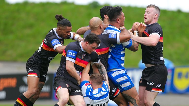 Halifax and Bradford players clash during their Challenge Cup meeting