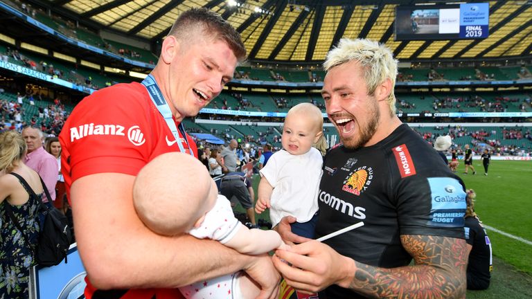 Jack Nowell of Exeter Chiefs and Owen Farrell of Saracens enjoy a moment with their children toge