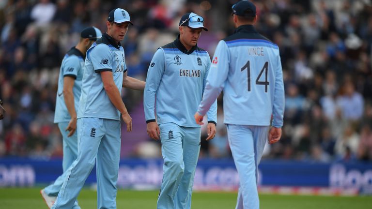 Jason Roy (centre) is consoled by Chris Woakes (left) after picking up a left hamstring strain