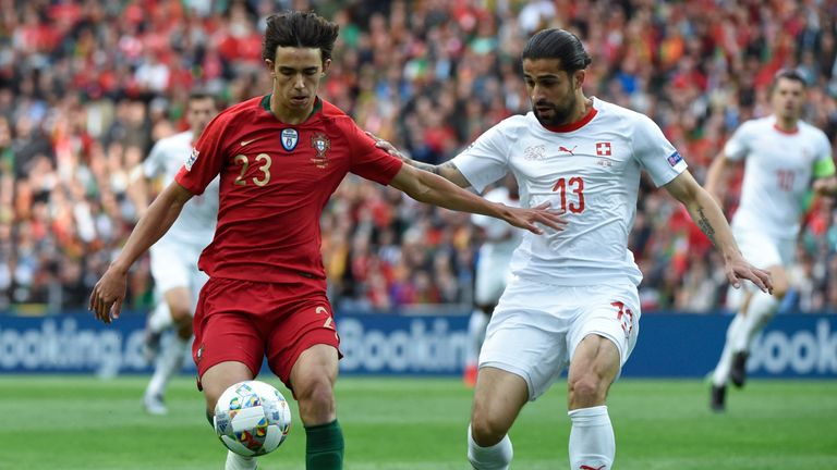 Joao Felix made his international debut in the UEFA Nations League semi-final between Portugal and Switzerland. Here, he holds the ball off Ricardo Rodriguez
