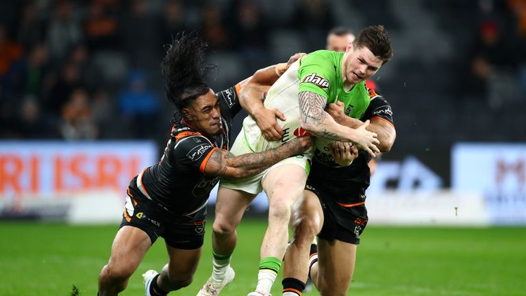 SYDNEY, AUSTRALIA - JUNE 07: John Bateman of the Raiders is tackled during the round 13 NRL match between the Wests Tigers and the Canberra Raiders at Bankwest Stadium on June 07, 2019 in Sydney, Australia. (Photo by Cameron Spencer/Getty Images)