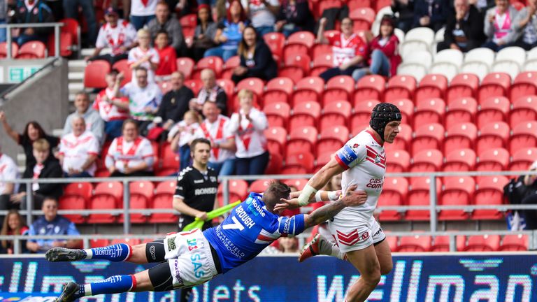 Jonny Lomax breaks free of a tackle by Danny Brough