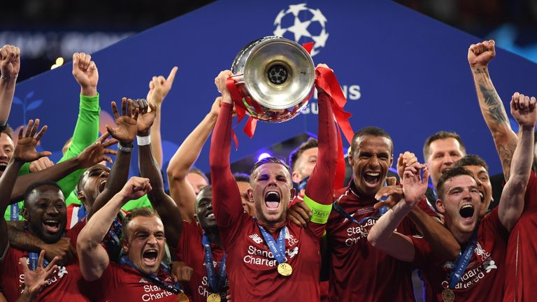 Jordan Henderson lifts the Champions League trophy