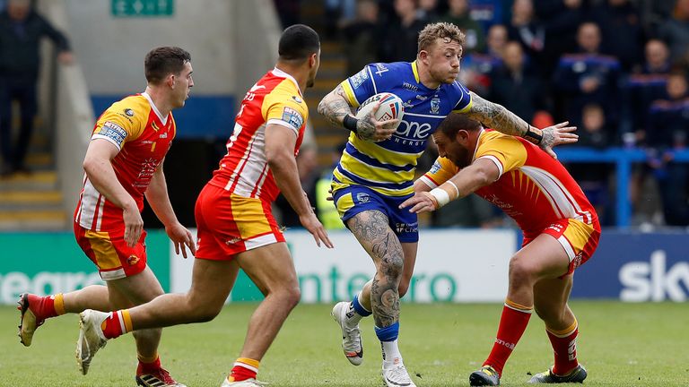Warrington Wolves' Josh Charnley is tackled by Catalans Dragons' Julian Bousquet (right) and Fouad Yaha (left) during the Betfred Super League match at The Halliwell Jones Stadium, Warrington. PRESS ASSOCIATION Photo. Picture date: Saturday June 8, 2019. See PA story RUGBYL Warrington. Photo credit should read: Martin Rickett/PA Wire. RESTRICTIONS: Editorial use only. No commercial use. No false commercial association. No video emulation. No manipulation of images.
