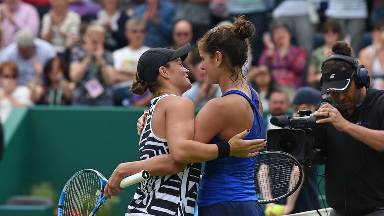 Julia Goerges (right) congratulates Barty on her victory