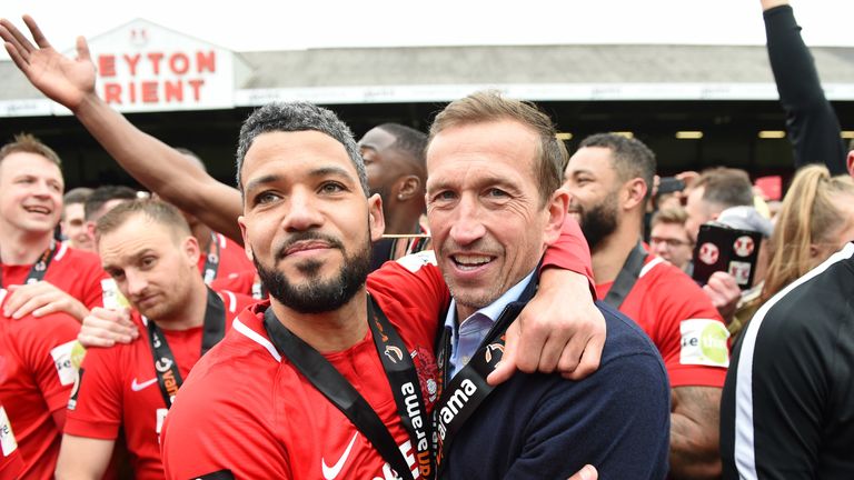 Leyton Orient manager Justin Edinburgh celebrates promotion back to the Football League with Jobi McAnuff