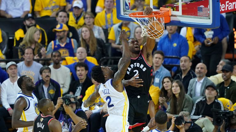 Kawhi Leonard of the Toronto Raptors dunks the ball against the Golden State Warriors in the first half during Game 3 of the 2019 NBA Finals