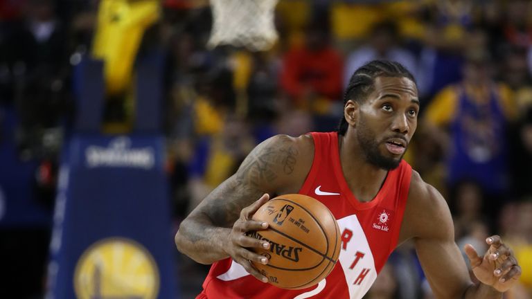  Kawhi Leonard #2 of the Toronto Raptors handles the ball on offense against the Golden State Warriors in the second half during Game Four of the 2019 NBA Finals at ORACLE Arena on June 07, 2019 in Oakland, California. 
