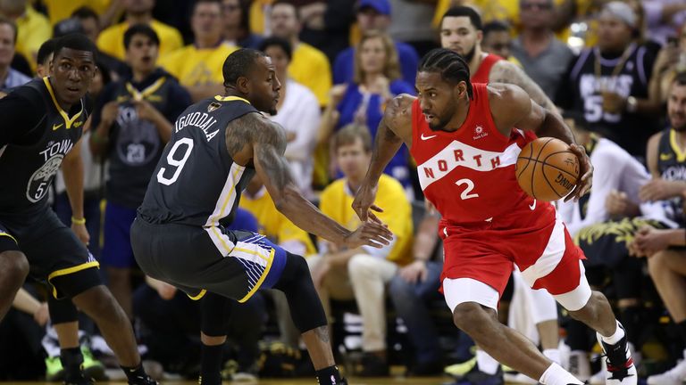 Kawhi Leonard #2 of the Toronto Raptors is defended by Andre Iguodala #9 of the Golden State Warriors in the first half during Game Four of the 2019 NBA Finals at ORACLE Arena on June 07, 2019 in Oakland, California.