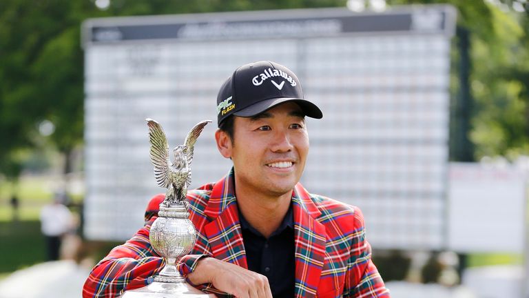 Kevin Na of the United States poses for a photo with the trophy after winning the Charles Schwab Challenge at Colonial Country Club