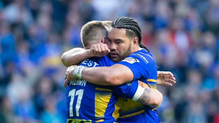 Picture by Allan McKenzie/SWpix.com - 14/06/2019 - Rugby League - Betfred Super League - Leeds Rhinos v Wigan Warriors - Emerald Headingley Stadium, Leeds, England - Leeds&#39;s Trent Merrin is congratulated by Konrad Hurrell on his try against Wigan.