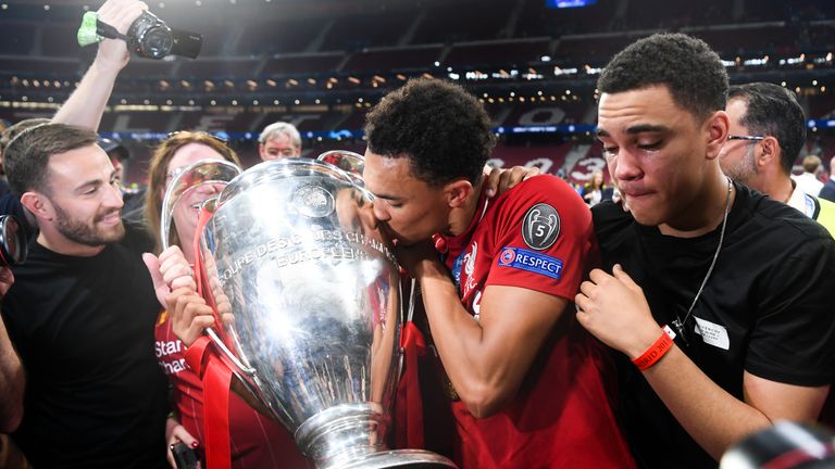 MADRID, SPAIN - JUNE 01: Trent Alexander-Arnold of Liverpool celebrates with the European Cup and members of his family during the UEFA Champions League Final between Tottenham Hotspur and Liverpool at Estadio Wanda Metropolitano on June 01, 2019 in Madrid, Spain. (Photo by Michael Regan/Getty Images)