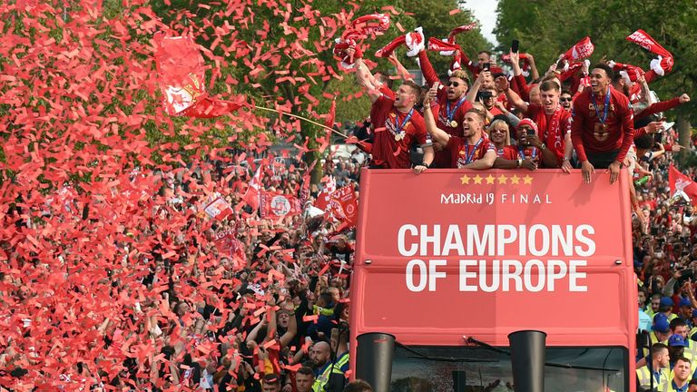L to R James Milner, Alex Oxlade-Chamberlain, Jordan Henderson, Daniel Sturridge and Trent Alexander-Arnold cheer their fans during an open-top bus parade around Liverpool, north-west England on June 2, 2019, after winning the UEFA Champions League final football match between Liverpool and Tottenham. - Liverpool's celebrations stretched long into 