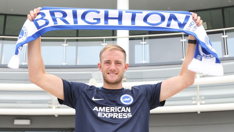 Matt Clarke signs for Brighton and Hove Albion - pictured holding scarf (pic courtesy of Brighton FC)