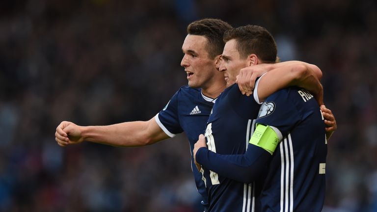 Scotland's John McGinn celebrates with Andy Robertson