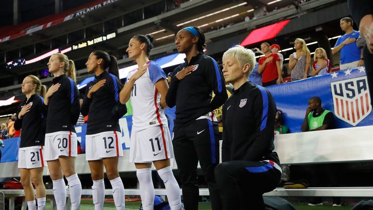 Megan Rapinoe kneels during the US national anthem in 2016