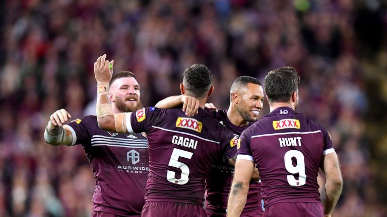 Moses Mbye celebrates victory with team-mates Dane Gagai, Josh McGuire and Ben Hunt