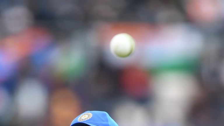 India's Mahendra Singh Dhoni fields during the 2019 Cricket World Cup group stage match between South Africa and India at the Rose Bowl in Southampton, southern England