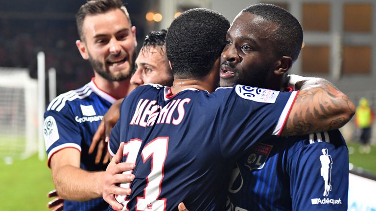 Tanguy Ndombele celebrates a goal for Lyon