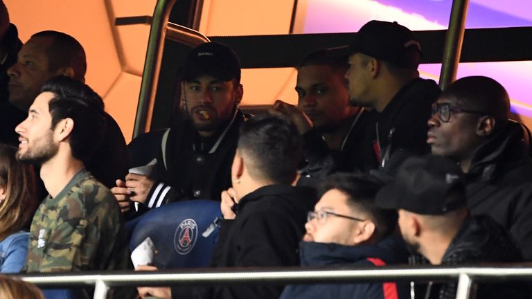 Neymar watches on during PSG's round of 16 game against Manchester United in March.