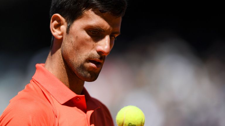 Serbia's Novak Djokovic reacts during his men's singles semi-final match against Austria's Dominic Thiem on day fourtenn of The Roland Garros 2019 French Open tennis tournament in Paris on June 8, 2019. (