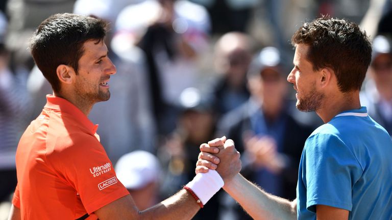 Novak Djokovic congratulates Dominic Thiem at the net