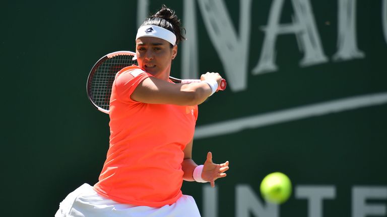 Tunisia's Ons Jabeur returns against France's Alize Cornet during their quarter-final at the WTA Nature Valley International in Eastbourne