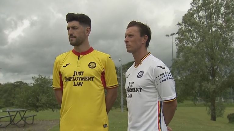 Joe Cardle (right) models Partick Thistle&#39;s away shirt supporting the LGBT movement with rainbow colours of the Pride flag.