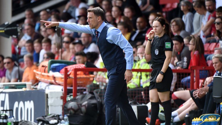WALSALL, ENGLAND - MAY 25: Phil Neville, Manager of England gives his team instructions during the International Friendly between England Women and Denmark Women at Bank's Stadium on May 25, 2019 in Walsall, England. (Photo by Nathan Stirk/Getty Images)