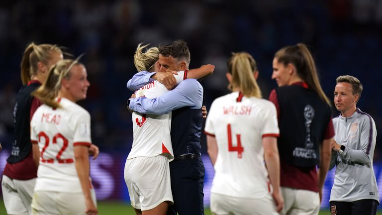 England boss Phil Neville celebrates victory with Steph Houghton