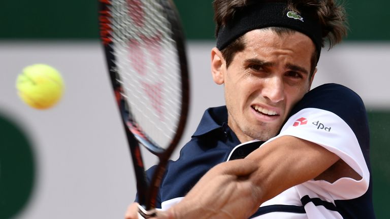 Pierre-Hugues Herbert returns the ball to France's Benoit Paire during their men's singles second round match on day four of The Roland Garros 2019 French Open tennis tournament in Paris on May 29, 2019. 