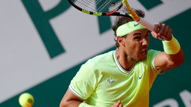 Spain's Rafael Nadal returns the ball to Japan's Kei Nishikori during their men's singles quarter-final match on day ten of The Roland Garros 2019 French Open tennis tournament in Paris on June 4, 2019. 